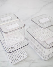 Load image into Gallery viewer, Fridge container set includes four fridge containers that are clear, strong and durable. Features removable dividers for drainage. Can be stacked. Keeps refrigerated food fresher for longer.
