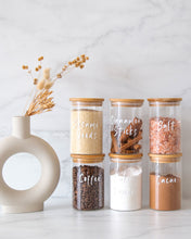 Load image into Gallery viewer, Glass jar with a bamboo lid and silicone seal for storing nuts, seeds, coffee and more