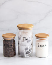 Load image into Gallery viewer, Set of three glass jars with a bamboo lid and silicone seal, featuring one large and two smaller jars
