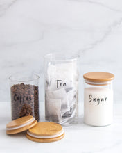 Load image into Gallery viewer, Set of three glass jars with a bamboo lid and silicone seal, featuring one large and two smaller jars