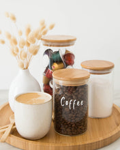 Load image into Gallery viewer, Set of three glass jars with a bamboo lid and silicone seal, featuring one large and two smaller jars