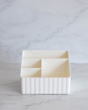 Load image into Gallery viewer, Tiered off white container with two small and two large compartments, used to store toiletries, stationary, or under sink items