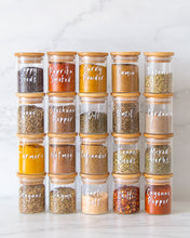 Load image into Gallery viewer, Glass and bamboo herb and spice jars used to store packets of herbs and spices in the kitchen