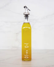 Load image into Gallery viewer, Glass oil bottle with easy to pour pourers to store oils and vinegars and use when cooking