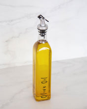 Load image into Gallery viewer, Glass oil bottle with easy to pour pourers to store oils and vinegars and use when cooking
