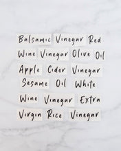 Load image into Gallery viewer, Vinyl labels set with standard oils and vinegars that peel back and stick onto glass oil bottles