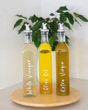Load image into Gallery viewer, Glass oil bottle with easy to pour pourers to store oils and vinegars and use when cooking