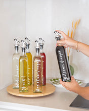 Load image into Gallery viewer, Glass oil bottle with easy to pour pourers to store oils and vinegars and use when cooking