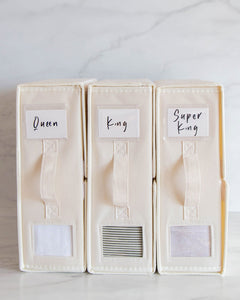Bed sheet organisers made from Oxford cloth. Used to differentiate between different sheet sizes. Features a handle and transparent square so you can see what sheets are inside