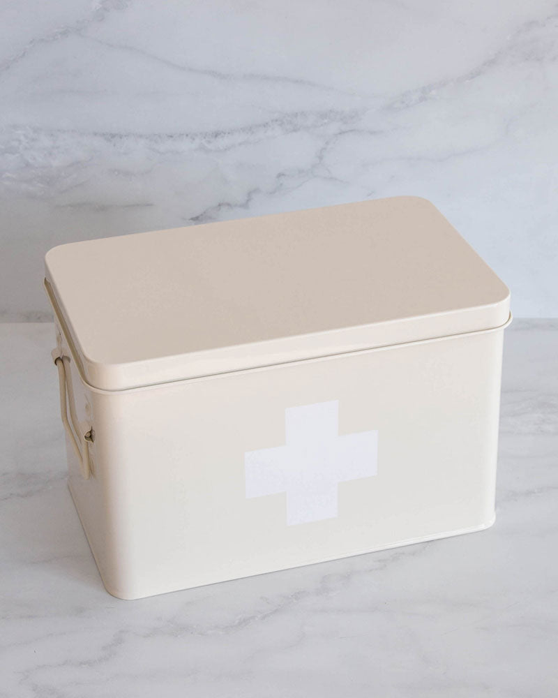 First aid container with a removable top shallow compartment, as well as several compartments within the container used to store all first aid items