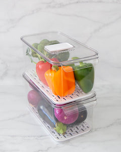 Fridge container that is clear, strong and durable. Features removable dividers for drainage. Can be stacked. Keeps refrigerated food fresher for longer.