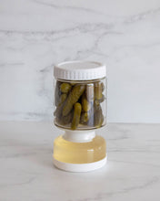 Load image into Gallery viewer, Glass pickle jar in hourglass shape to separate brine from pickles, olives, or other canned goods. Features airtight white silicone lid