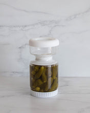 Load image into Gallery viewer, Glass pickle jar in hourglass shape to separate brine from pickles, olives, or other canned goods. Features airtight white silicone lid