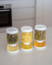 Load image into Gallery viewer, Glass pickle jar in hourglass shape to separate brine from pickles, olives, or other canned goods. Features airtight white silicone lid