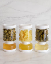 Load image into Gallery viewer, Glass pickle jar in hourglass shape to separate brine from pickles, olives, or other canned goods. Features airtight white silicone lid