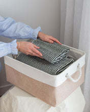 Load image into Gallery viewer, Beige and white storage basket made from linen with a cotton rope handle with towels inside