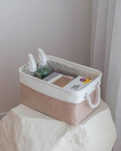 Load image into Gallery viewer, Beige and white storage basket made from linen with a cotton rope handle with cleaning products inside 