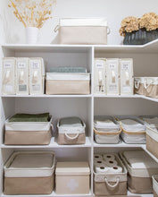 Load image into Gallery viewer, Organised storage shelves with labeled bed sheet organisers and various baskets in the linen cupboard 
