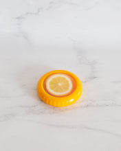 Load image into Gallery viewer, Silicone lemon saver pod with flexible lid designed to keep cut lemons fresh and prevent drying