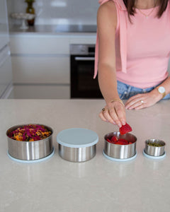 Stainless steel container set with leakproof silicone lid for food storage. Set of 4 containers ranging from small to large. Perfect for storing nuts, seeds, fruit, snacks & leftovers