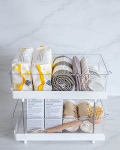 Under sink drawer organiser with compartments and sliding drawers to store under sink items such as dishwasher tablets, dishwashing liquid, rubbish bags, wipes, and cleaning products