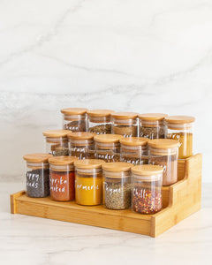 Bamboo spice rack with three tiers used to display spice jars or keep canned goods contained and organised