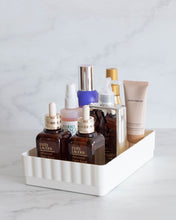 Load image into Gallery viewer, White bathroom container designed to fit in bathroom drawers and store toiletries such as skincare, makeup, haircare and perfumes