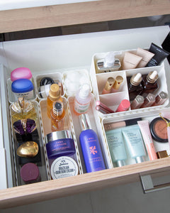 Bathroom container set designed to fit in bathroom drawers and store toiletries such as skincare, makeup, haircare and perfumes