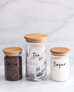 Set of three glass jars with a bamboo lid and silicone seal, featuring one large and two smaller jars
