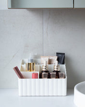 Load image into Gallery viewer, Tiered off white container with two small and two large compartments, used to store toiletries, stationary, or under sink items
