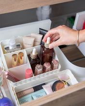 Load image into Gallery viewer, Tiered off white container with two small and two large compartments, used to store toiletries, stationary, or under sink items