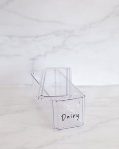 Set of clear, stackable, fridge containers with a small handle and lid, used to store dairy, drinks and vegetables in the fridge