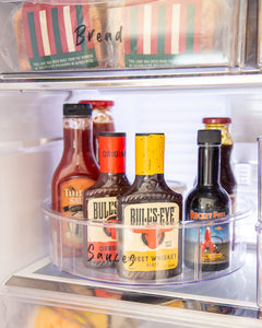 Transparent Lazy Susan that is 30cm diameter, used to store sauces and bottles in the fridge or pantry