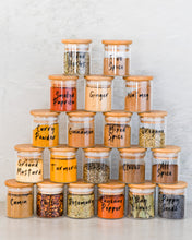 Load image into Gallery viewer, Vinyl labels set in black or white with standard herb and spice labels that peel back and stick onto kitchen jars