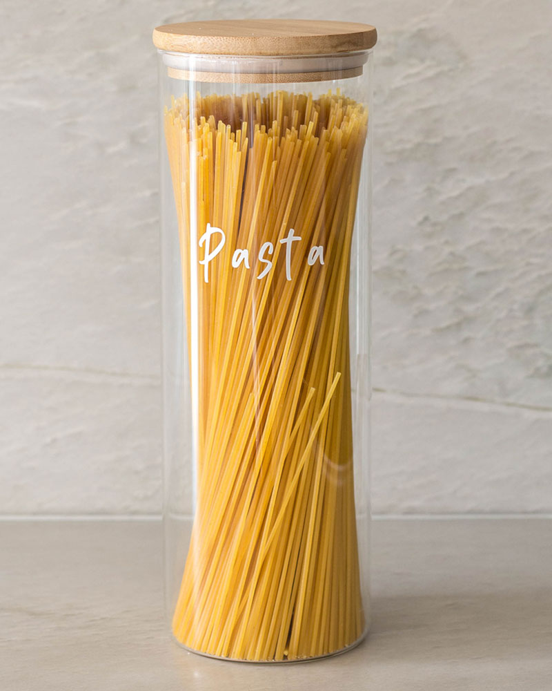 Glass jar with a bamboo lid and silicone seal for storing spaghetti and pasta