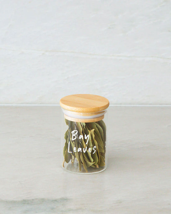Glass jar with a bamboo lid and silicone seal for storing herbs and spices