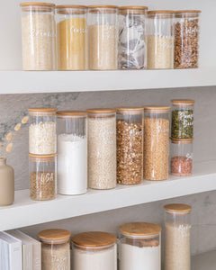 Pantry glass jars with bamboo lid and silicone seal used to store essential household pantry ingredients such as flour, sugar and spaghetti