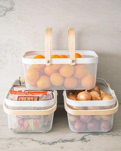 White mesh basket with wooden handles for organising and storing items in the kitchen, pantry and bedroom