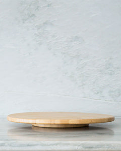 Bamboo lazy susan with spinning feature used to store items such as condiments, oils and spreads for easy access to items