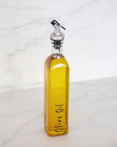 Glass oil bottle with easy to pour pourers to store oils and vinegars and use when cooking