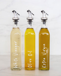 Vinyl labels set with standard oils and vinegars that peel back and stick onto glass oil bottles