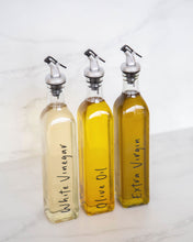 Load image into Gallery viewer, Glass oil bottle with easy to pour pourers to store oils and vinegars and use when cooking